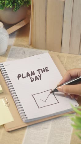 VERTICAL-VIDEO-OF-TICKING-OFF-PLAN-THE-DAY-WORK-FROM-CHECKLIST