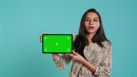 Energetic-salesman-doing-influencer-marketing-using-green-screen-tablet