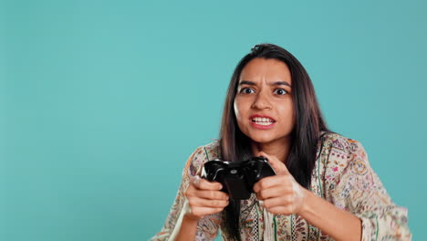 Upset-woman-showing-thumbs-down-sign-gesturing-holding-controller
