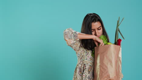 Ecology-lover-holding-shopping-bag-with-natural-produce