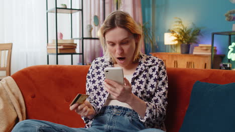 Angry-stressed-woman-trying-to-pay-online-shopping-with-smartphone-blocked-credit-card-smartphone