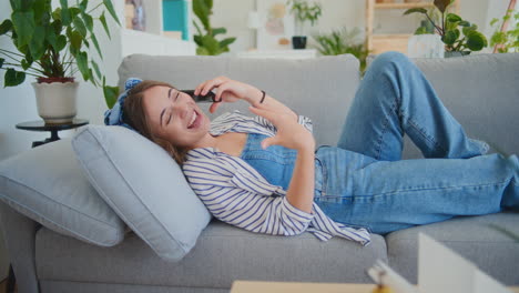 Relaxed-Woman-Talking-on-Mobile-Phone