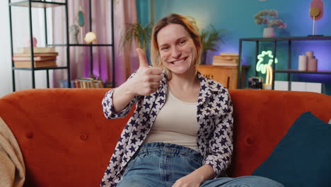 Excited-woman-looking-approvingly-at-camera-showing-double-thumbs-up-like-sign-positive-feedback