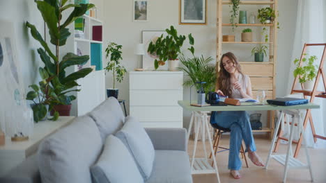 Female-Student-Learning-at-Desk-in-Home-Environment
