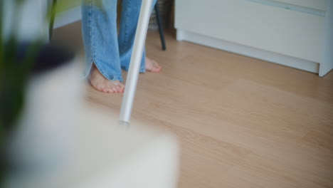 Close-Up-of-Vacuum-Cleaner-Removing-Dust-from-Floor
