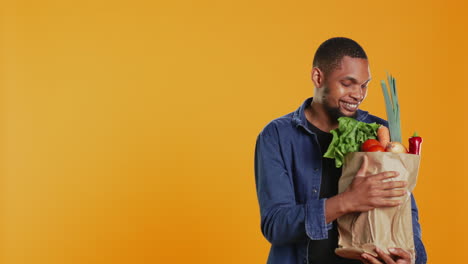 Vegan-person-enjoying-the-fresh-ripe-natural-aroma-of-groceries