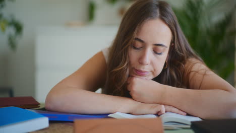 Tired-Female-Student-Doing-Homework
