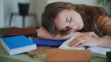Woman-Sleeping-on-Books-Bored