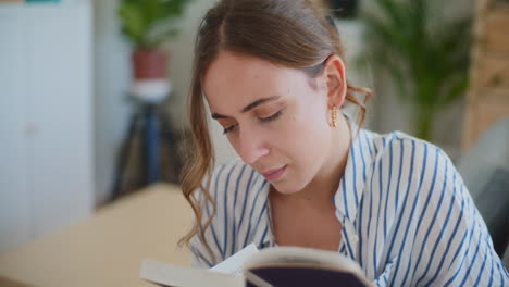 Close-Up-of-Woman-Reading-Book-at-Home