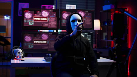 Hacker-doing-online-activism,-wearing-anonymous-masks-and-filming-video