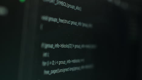 Extreme-close-up-shot-of-hacking-code-running-on-computer-system-monitors