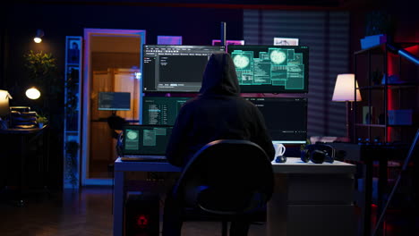 Hacker-arriving-in-secret-base-with-laptop,-ready-to-start-programming-viruses
