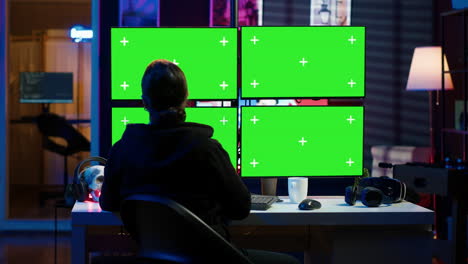 Cybercriminal-coding-on-green-screen-monitors,-developing-zero-day-exploit