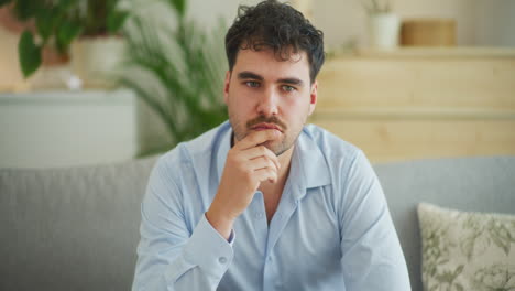 Portrait-of-Thoughtful-Man-at-Home