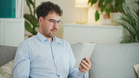 Confident-Businessman-Manages-Company-with-Tablet