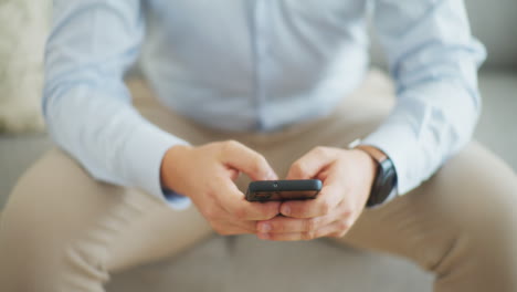 Close-Up-of-Man-Texting-on-Smartphone