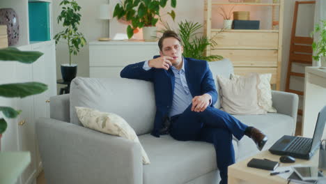 Confident-Businessman-on-Couch