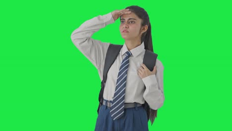 Indian-school-girl-looking-and-searching-someone-Green-screen
