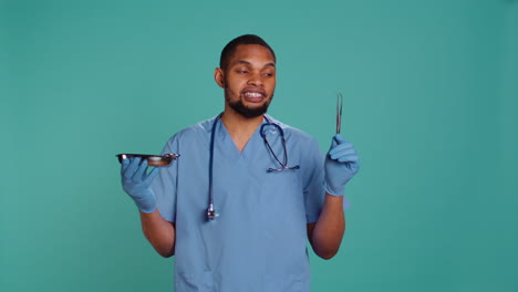 Portrait-of-doctor-holding-surgical-equipment,-preparing-to-do-medical-procedure