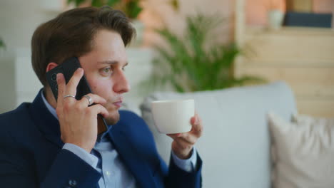 Businessman-Discusses-Over-Coffee