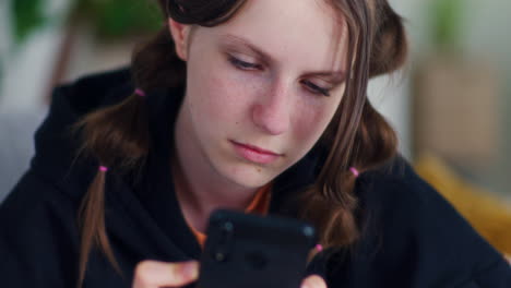 Teenage-Girl-Browses-the-Internet-on-a-Smartphone