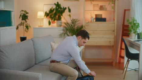 Businessman-Enters-House-with-Laptop