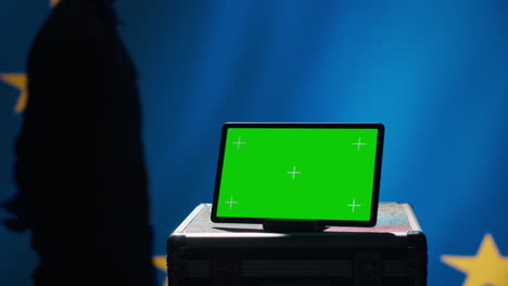 European-Union-agency-operator-using-military-tech-on-green-screen-tablet