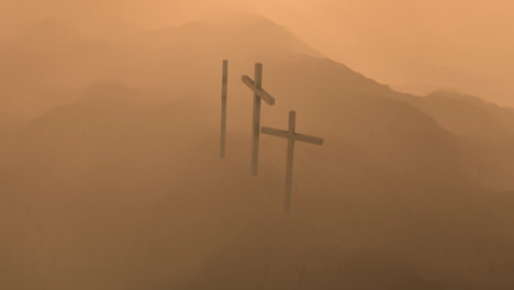 Atmospheric,-dramatic-dark-image-of-three-crosses-silhouetted-on-the-top-of-a-mountain.-Conceptual-image-of-the-biblical-Golgotha-mountain-in-Jerusalem,-where-Crucifixion-of-Christ-took-place.