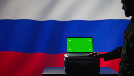 Russian-ex-KGB-FSB-service-using-radar-on-green-screen-laptop