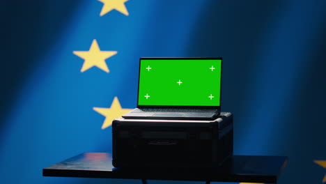 Technician-doing-cybersecurity-job-for-European-Union-with-mockup-notebook