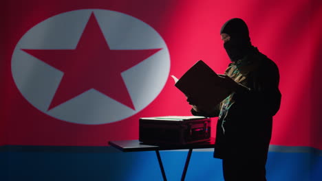 North-Korean-spy-taking-out-intel-document-from-suitcase