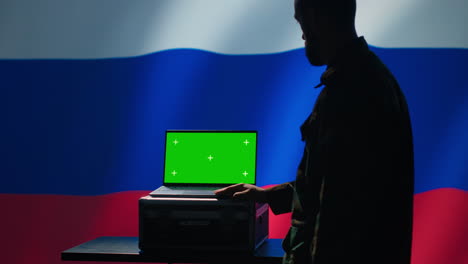 Russian-ex-KGB-FSB-service-using-radar-on-green-screen-laptop