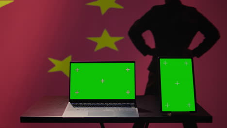 Chinese-soldier-using-military-tech-on-green-screen-laptop-to-identify-threats