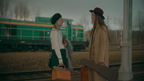 Women-Talking-At-Railway-Station