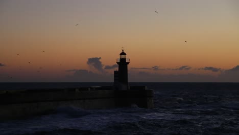 lighthouse-sunset-in-Porto,-strong-ocean