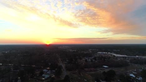 Aerial-Time-lapse-of-a-beautiful-sunset,-featuring-afternoon-traffic