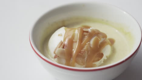 French-Traditional-Dessert-“Ile-Flottante”-spoon-going-in