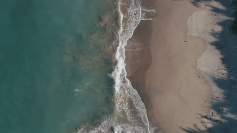 Aerial-birds-eye-rising-shot-of-waves-on-coast-of-Sorsogon
