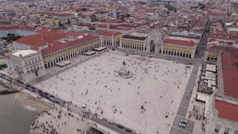 Tourist-on-famous-square-Terreiro-do-Paco-in-Lisbon,-Portugal,-aerial-orbit