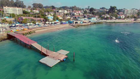 Coast-Dock-at-El-Pejerrey-Beach-Algarrobo-Chile-Aerial-View-Above-Blue-Sea-Water-in-Resort-Holiday-Destination-at-South-America,-Summer-Vibes