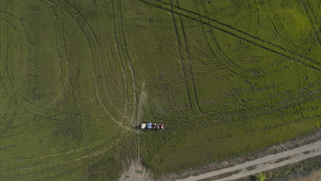 Bird-eyes-view-of-a-Farmer-spraying-pesticides-on-rice-field-in-Cambodia