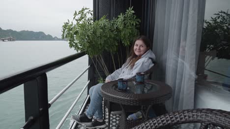 Woman-Sitting-On-The-Balcony-Of-A-Cruise-Ship