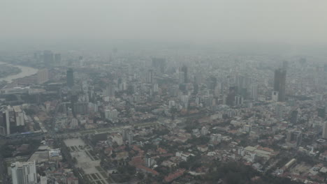 Aerial-wide-pan-over-Phnom-Penh-with-pollution