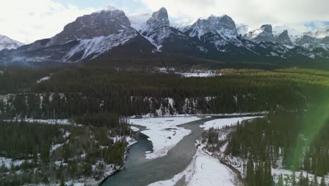 Aerial-pan-of-Bow-River,-Canmore,-Alberta,-Canada---Drone-4k