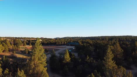 Aerial-View-Of-Campground-And-Forest-During-Sunset