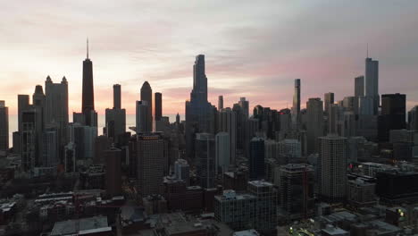 Near-north-side-skyline,-dawn-in-Chicago,-United-states---pull-back,-aerial-view