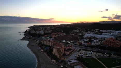 fuengirola-sunset-aerial-flyover-city-push-in-movement