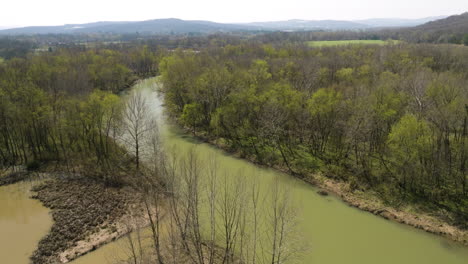 Aerial-rotate-with-tilt-up-showing-the-murky-waters-of-Middle-Fork-White-River