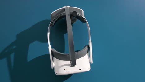 A-virtual-reality-headset-to-experience-an-immersive-adventure-simulator-rests-on-a-wall-hanger