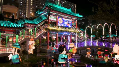 Nighttime-view-of-a-public-park-decorated-with-Chinese-lanterns-at-a-lantern-show-as-visitors-are-seen-inside-the-Wong-Tai-Sin-temple-complex-during-the-Mid-Autumn-Festival-
